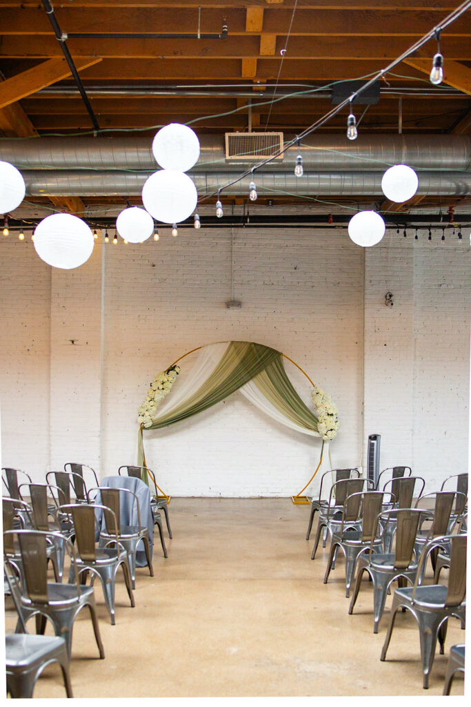 A wedding ceremony set up inside of SKYLIGHT in Denver