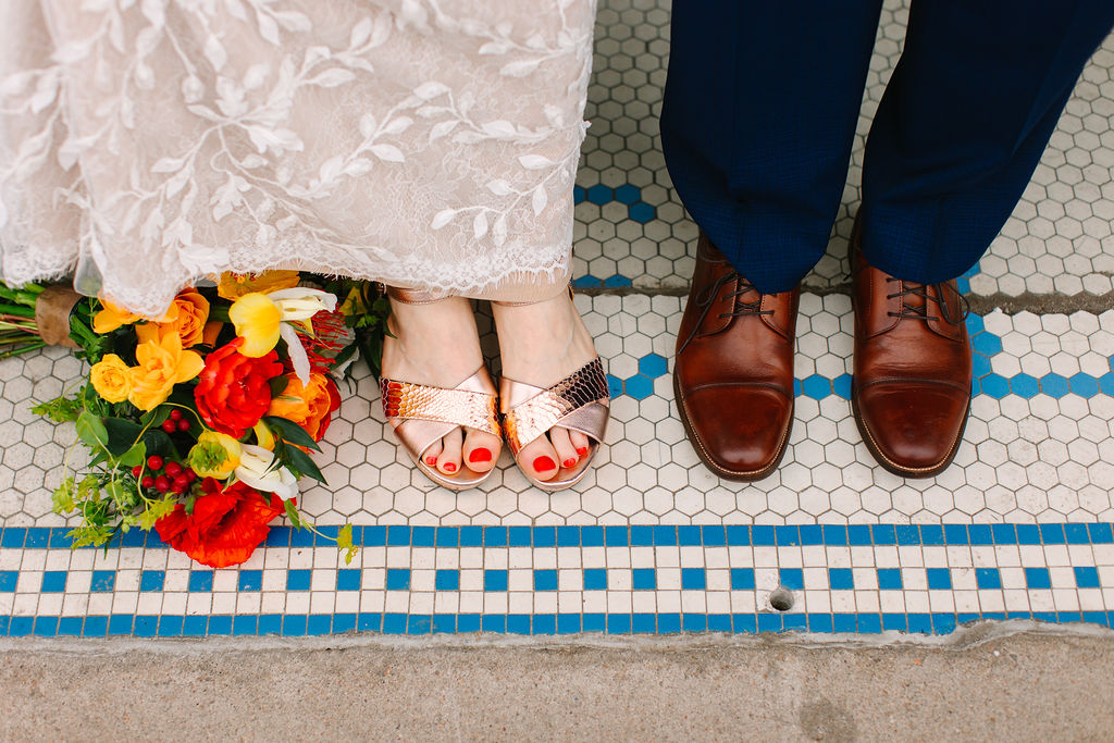 A bride and groom's shoe choices in the Santa Fe Arts District.