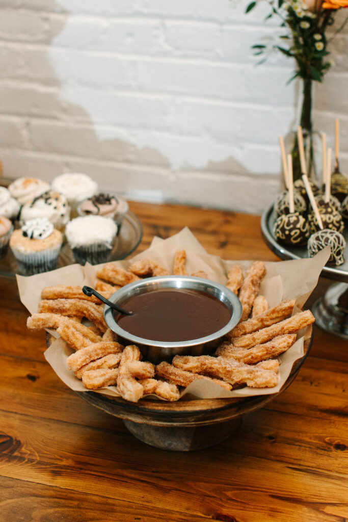 Churros on a dessert display at SKYLIGHT in Denver