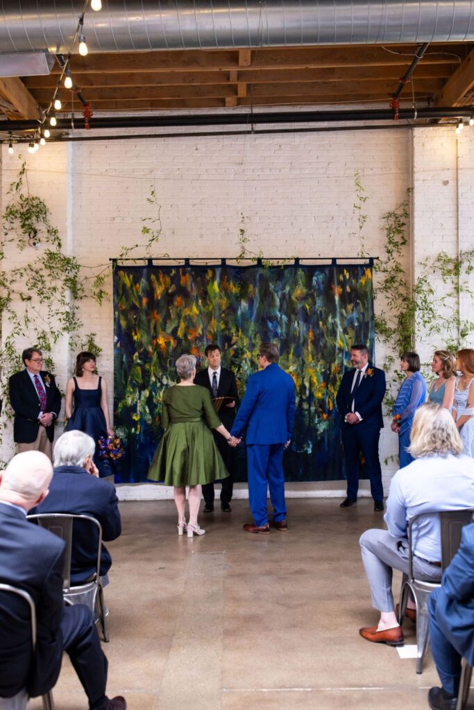 Laura and Rick celebrate their Denver wedding with a creative backdrop