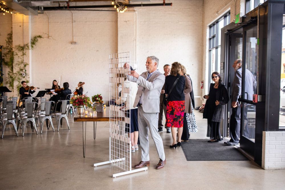 Wedding guests sign a guestbook