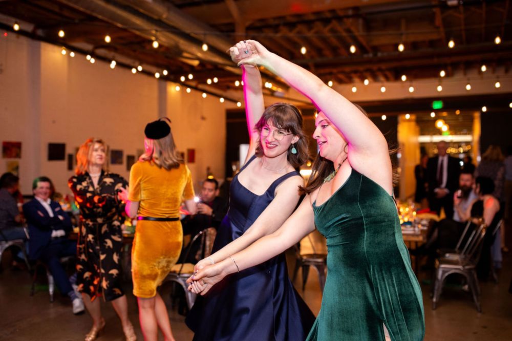 Guests dance at a Denver wedding at SKYLIGHT