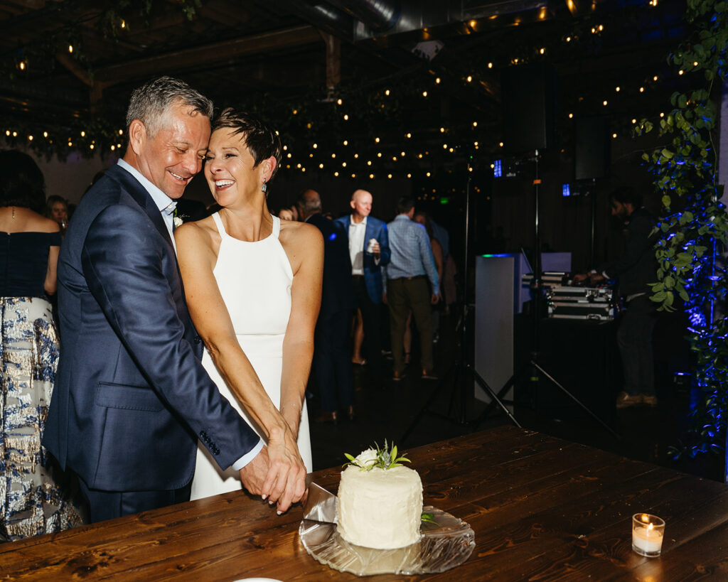 Bride and groom cutting the cake