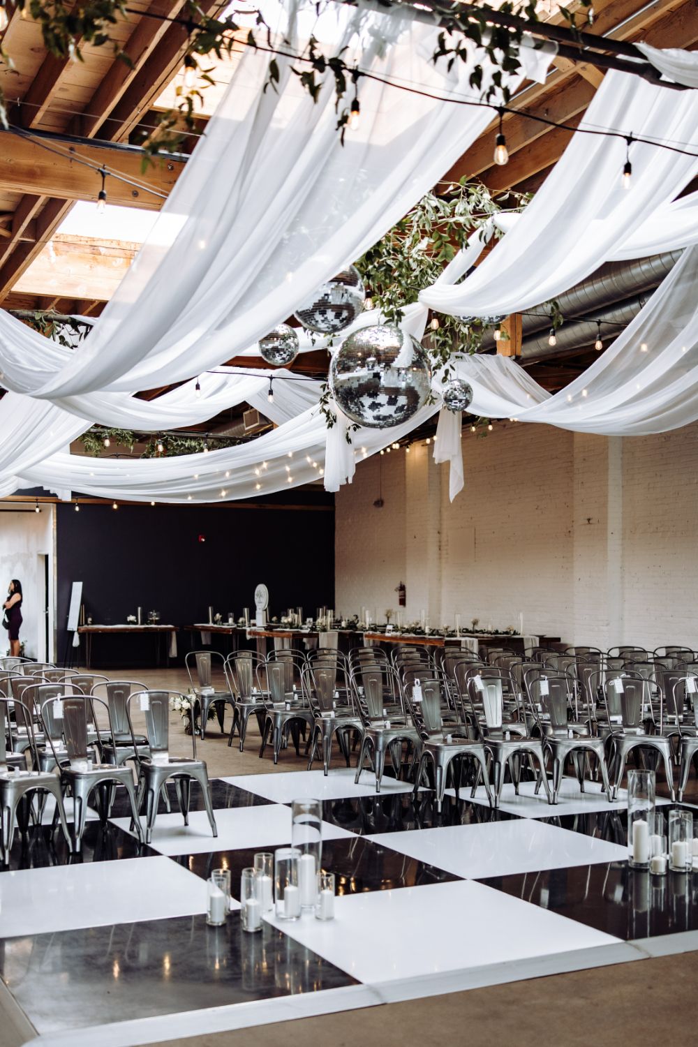 White draping over ceremony space at a Denver wedding venue that transforms into a dance floor