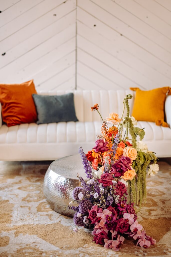 Lounge area with disco balls and florals at SKYLIGHT