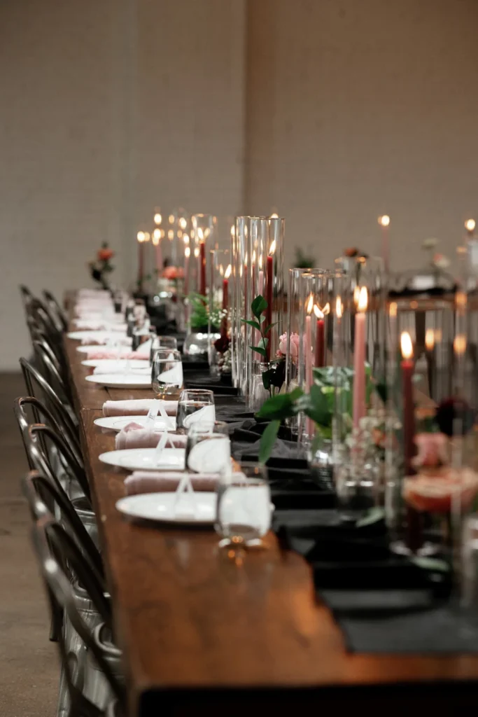 Guest tables with candlelight and winter greenery at SKYLIGHT in Denver