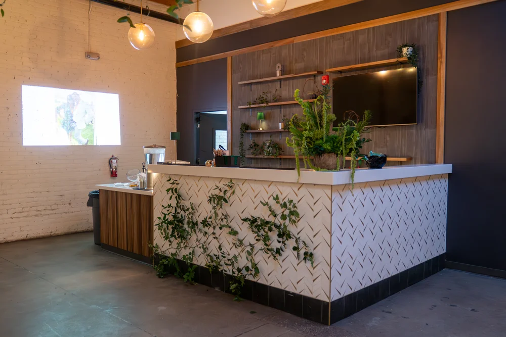 SKYLIGHT bar set up with greenery for an event in Denver, CO