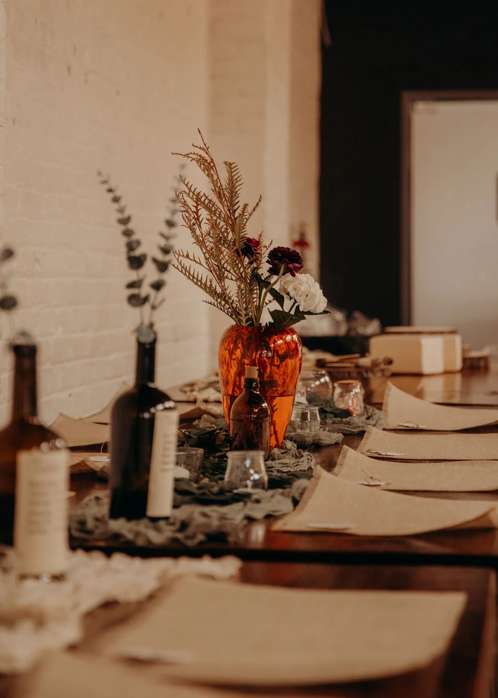 Guest tables set up with sustainable/reusable decor for a wedding at SKYLIGHT in Denver, CO