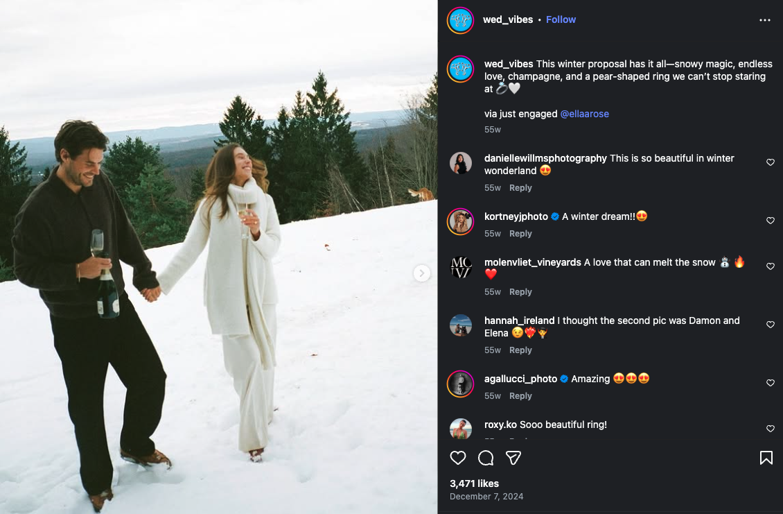Couple walking through snow during a winter engagement photo session