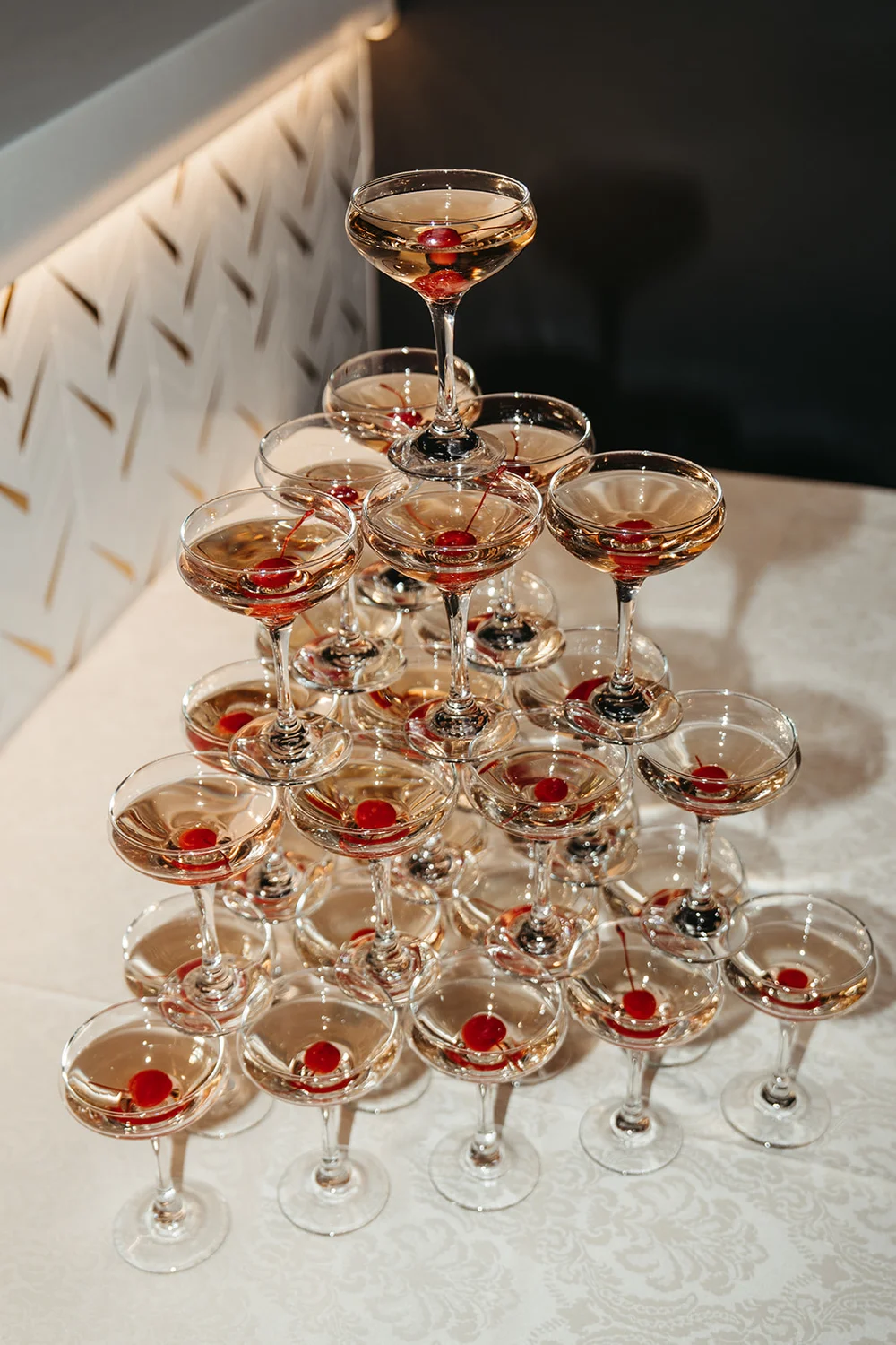 Champagne tower with cherries at a SKYLIGHT Denver event